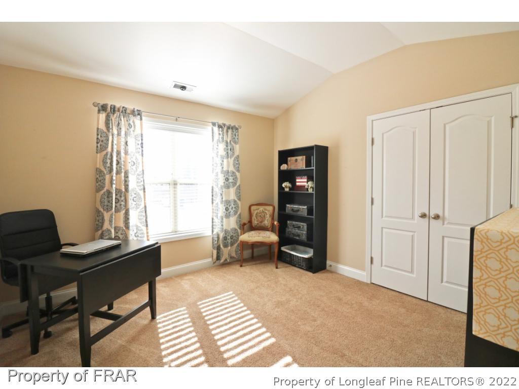 740 Sun Road Aberdeen, NC 28315 - Photo 23 of 36 a bedroom with furniture and a window
