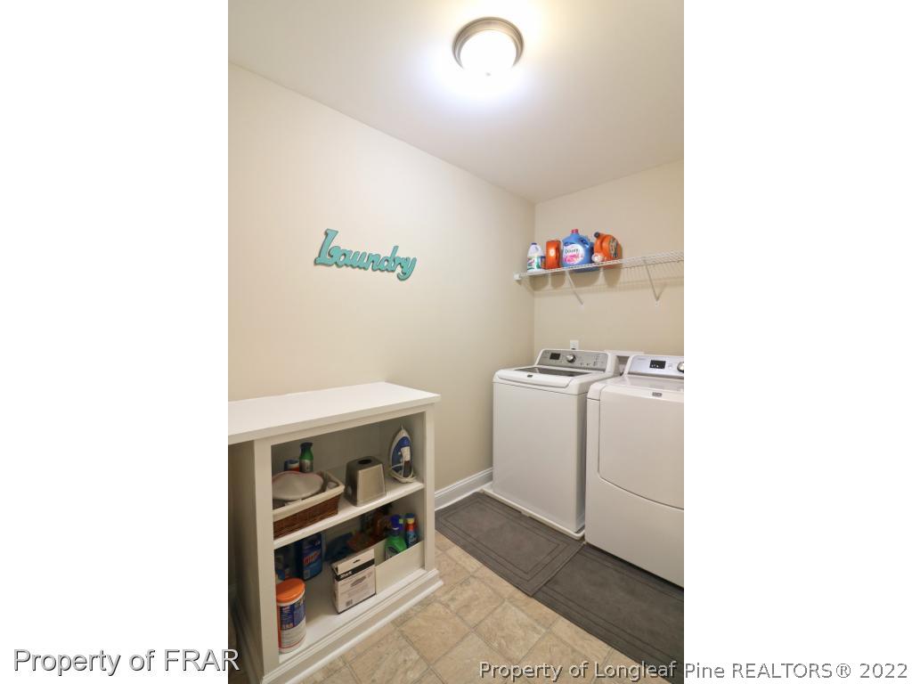 740 Sun Road Aberdeen, NC 28315 - Photo 24 of 36 a bathroom with a sink a vanity and a window