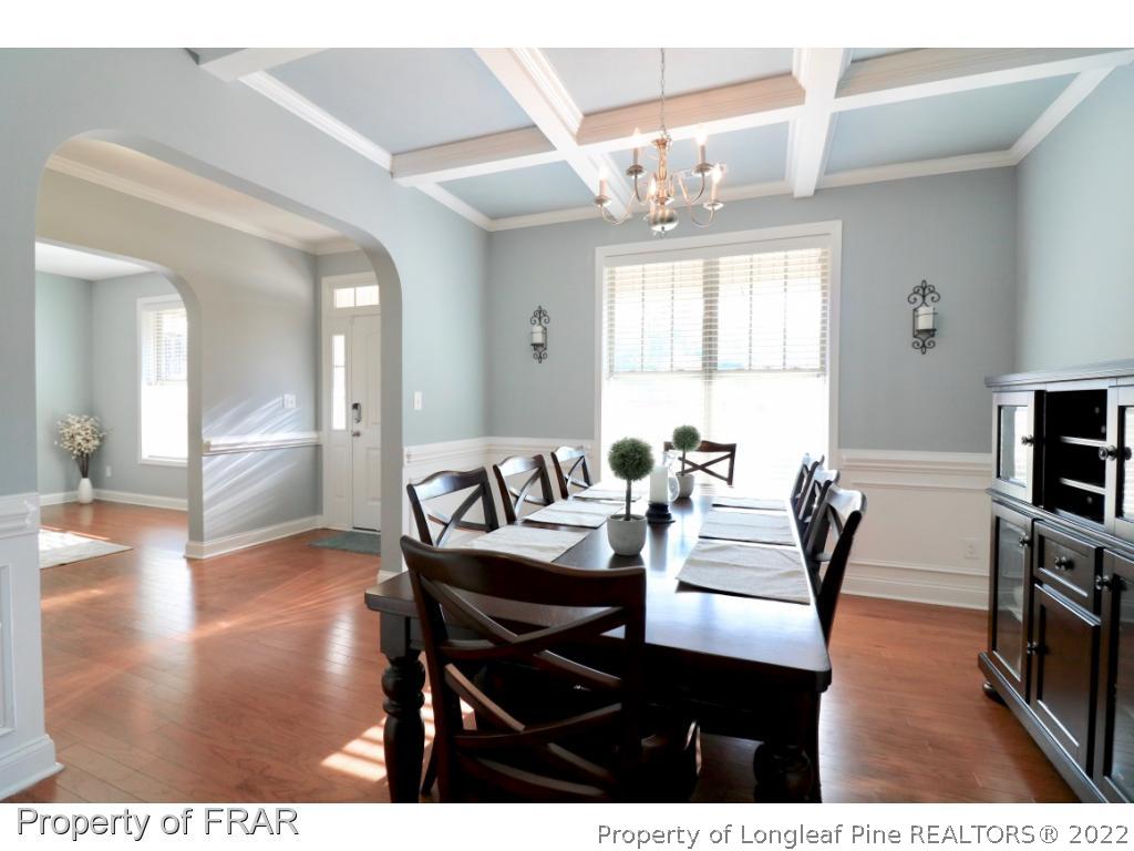 740 Sun Road Aberdeen, NC 28315 - Photo 6 of 36 a view of a dining room with furniture and wooden floor