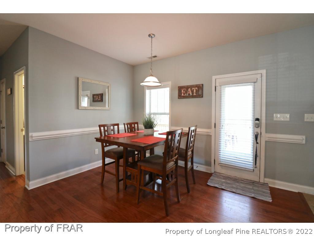 740 Sun Road Aberdeen, NC 28315 - Photo 9 of 36 a view of a dining room with furniture and window