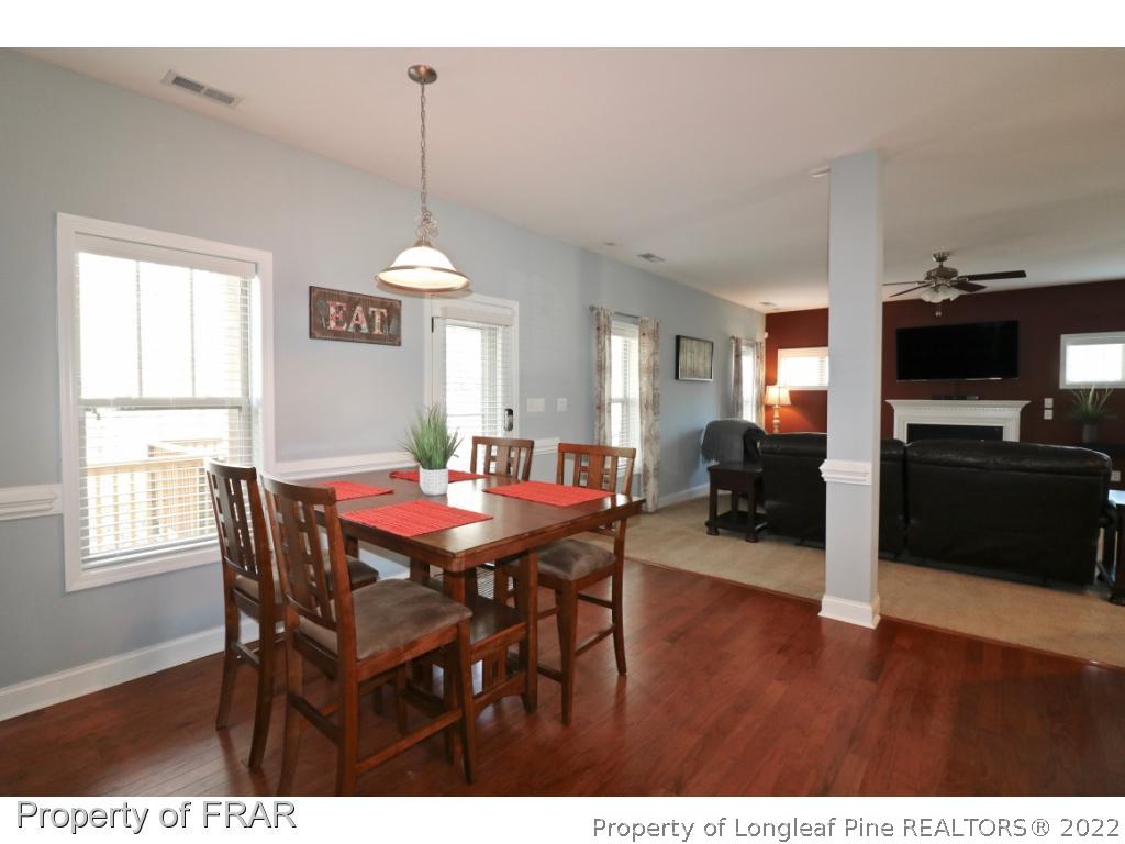 740 Sun Road Aberdeen, NC 28315 - Photo 10 of 36 a dining room with furniture window and wooden floor