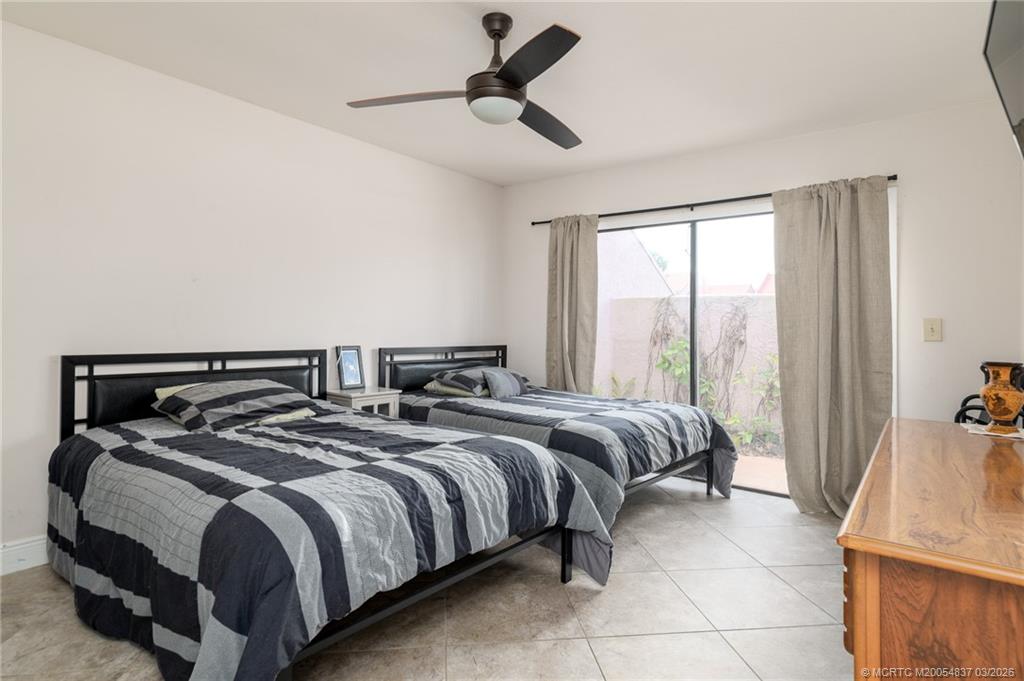 3504 Southeast Sandpiper Circle Port St. Lucie, FL 34952 - Photo 16 of 31 First bedroom with en suite bathroom