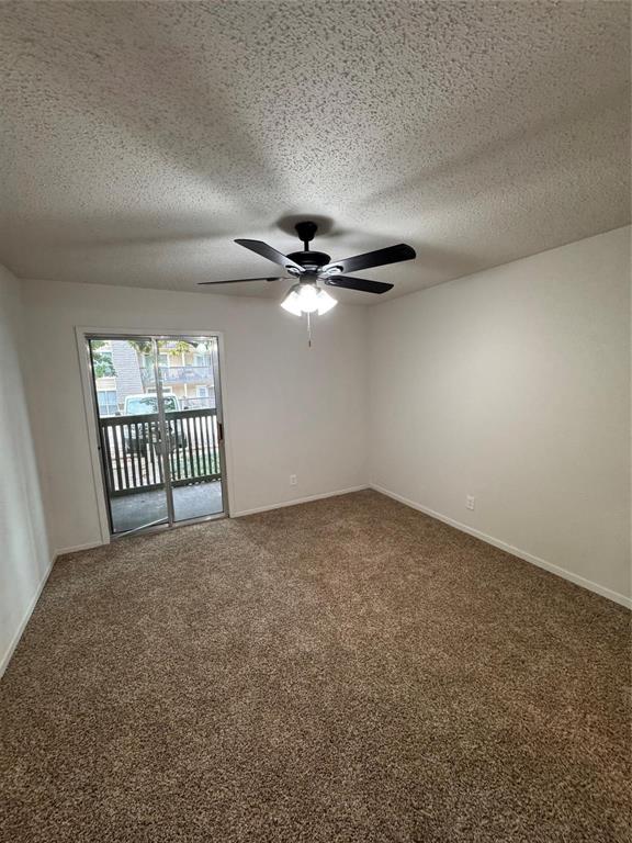 4859 Cedar Springs Road, Unit 150 Dallas, TX 75219 - Photo 18 of 24 a view of a livingroom with a ceiling fan and window