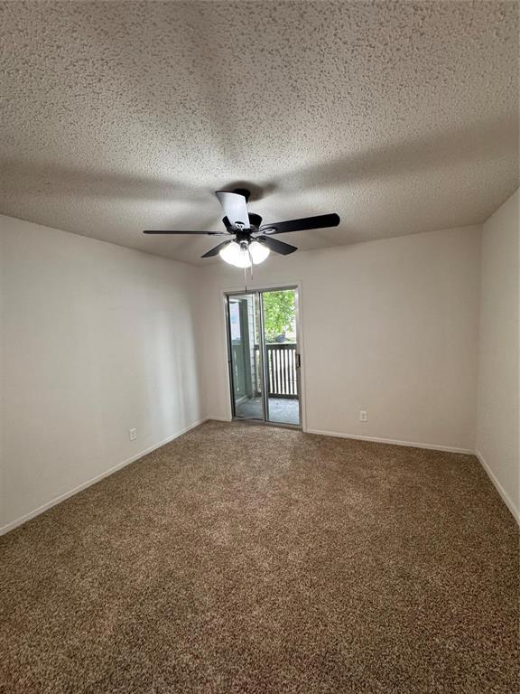 4859 Cedar Springs Road, Unit 150 Dallas, TX 75219 - Photo 22 of 24 a view of an empty room with a window
