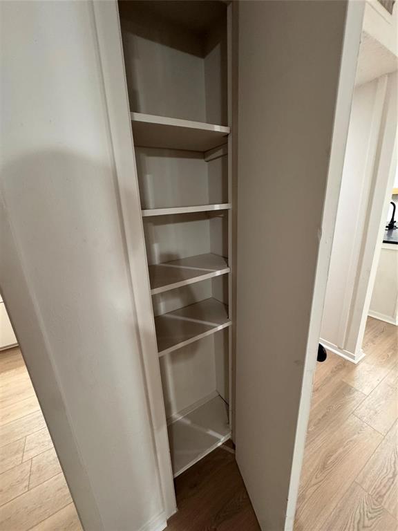 4859 Cedar Springs Road, Unit 150 Dallas, TX 75219 - Photo 23 of 24 a view of walk in closet with empty racks
