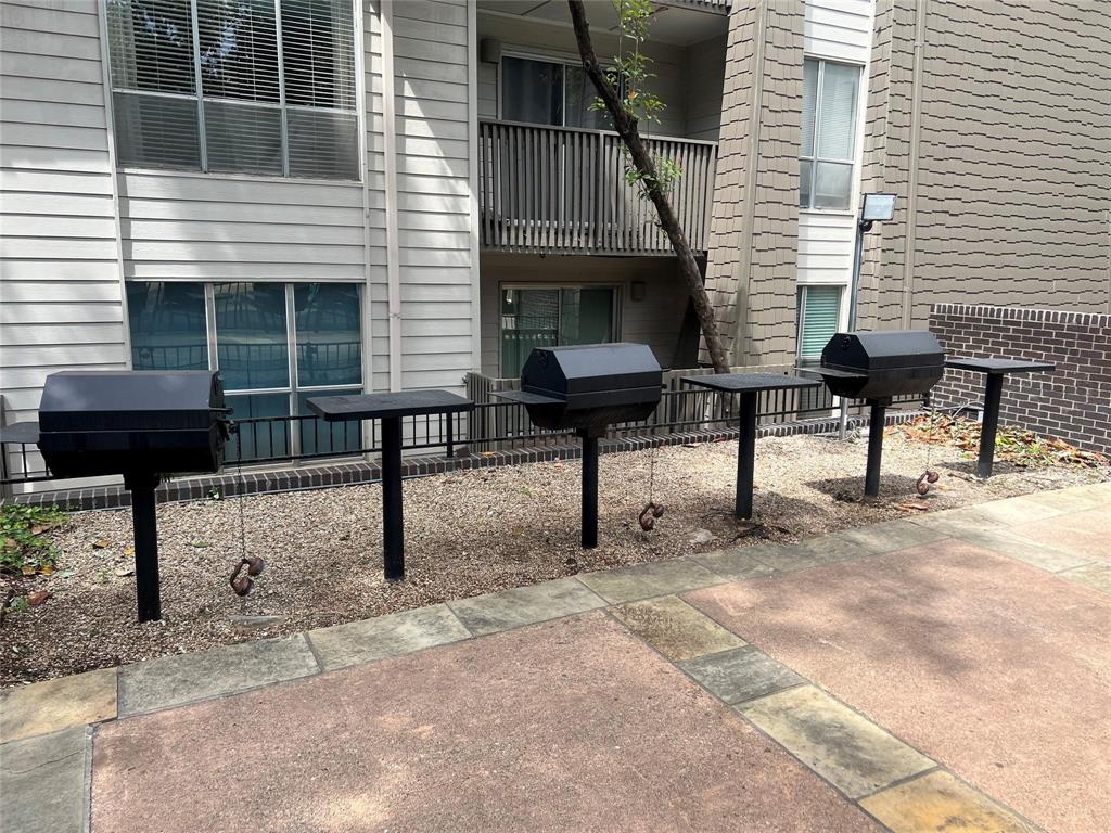 4859 Cedar Springs Road, Unit 150 Dallas, TX 75219 - Photo 5 of 24 a view of a house with backyard and sitting area