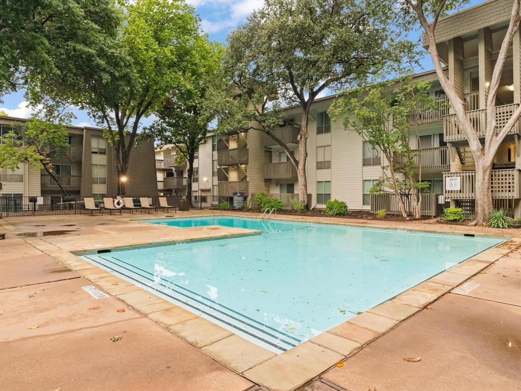 4859 Cedar Springs Road, Unit 150 Dallas, TX 75219 - Photo 7 of 24 a view of a building with a swimming pool