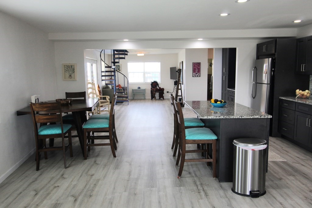 189 Sailfish Drive Rockport, TX 78382 - Photo 18 of 40 a view of a dining room with furniture and wooden floor