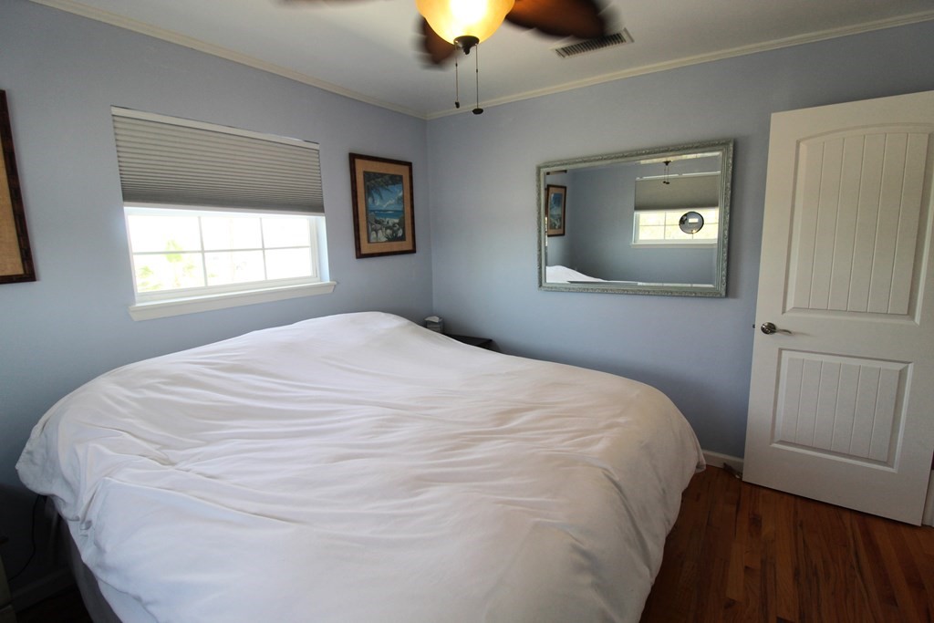 189 Sailfish Drive Rockport, TX 78382 - Photo 22 of 40 a large white bed in a bedroom next to a window