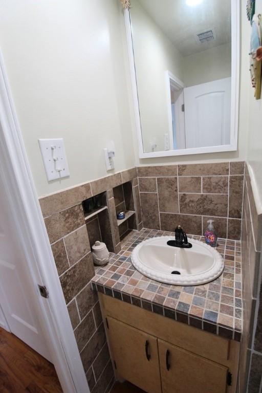 189 Sailfish Drive Rockport, TX 78382 - Photo 25 of 40 a bathroom with a sink a toilet and mirror