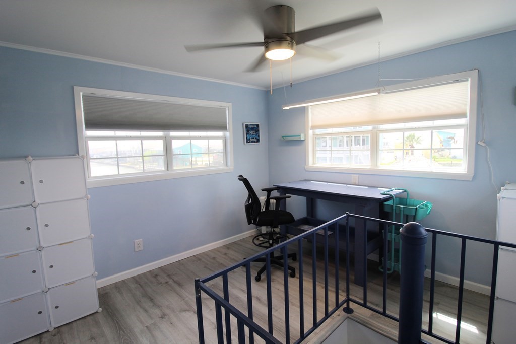 189 Sailfish Drive Rockport, TX 78382 - Photo 30 of 40 a view of a livingroom with wooden floor and windows