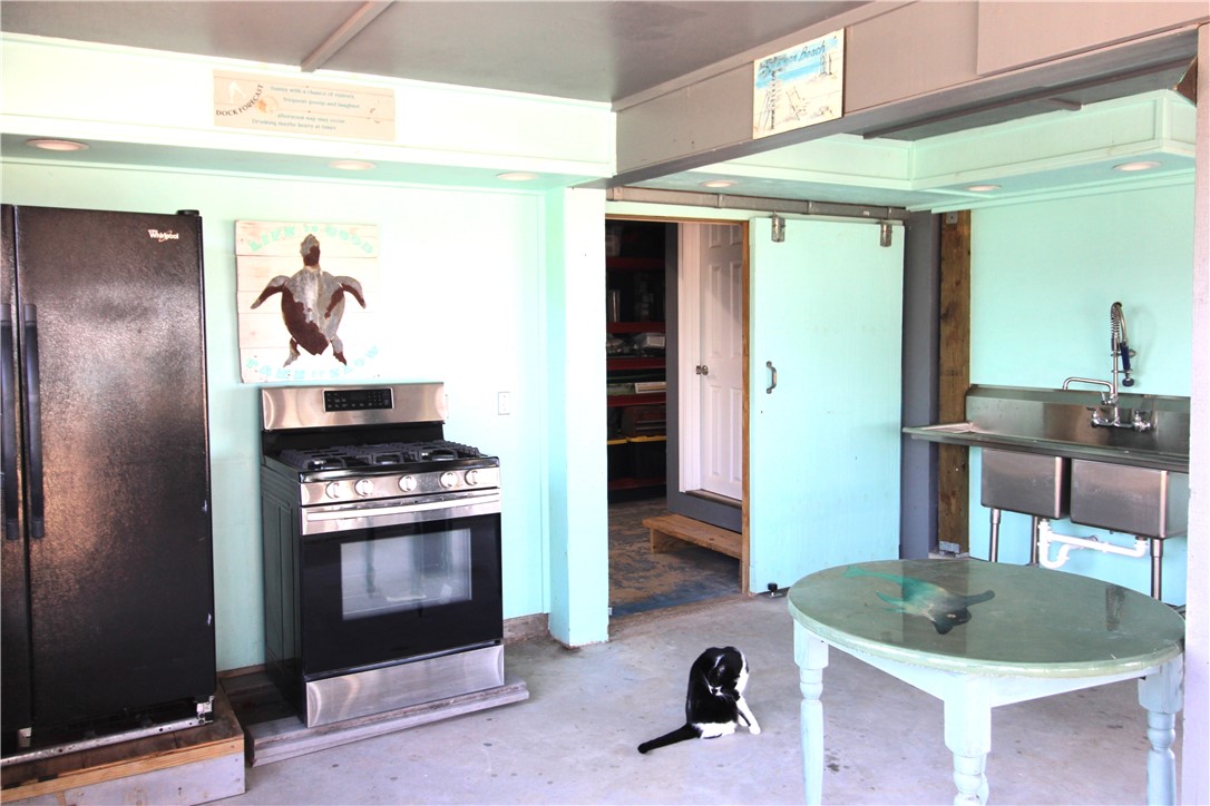 189 Sailfish Drive Rockport, TX 78382 - Photo 35 of 40 a kitchen with a stove and a sink