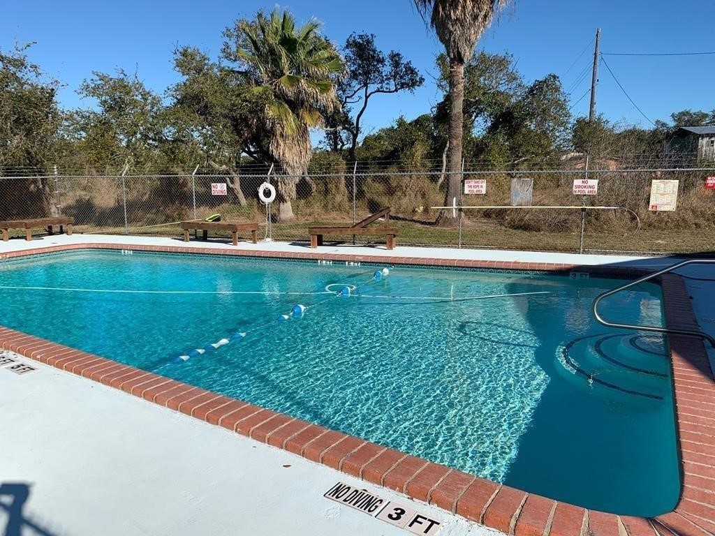 189 Sailfish Drive Rockport, TX 78382 - Photo 38 of 40 a view of a swimming pool with a patio