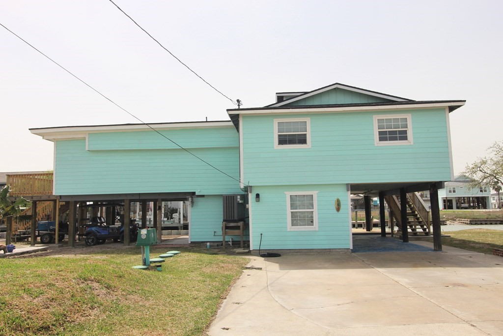 189 Sailfish Drive Rockport, TX 78382 - Photo 5 of 40 a front view of a house with a yard