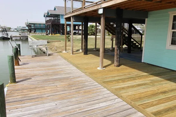a swimming pool with barbeque oven in front of it
