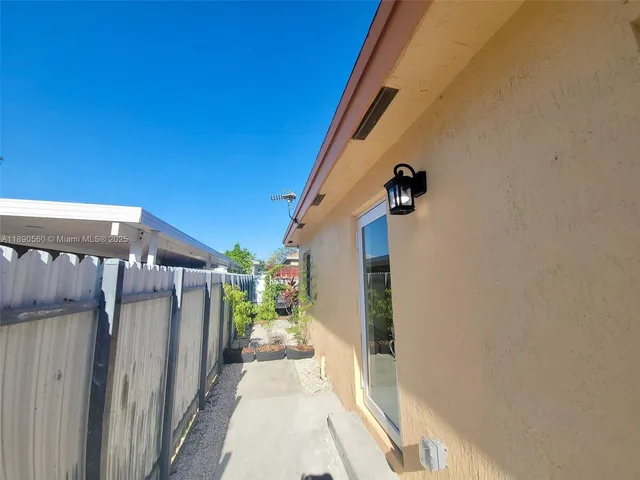 a view of a walk in front of a house
