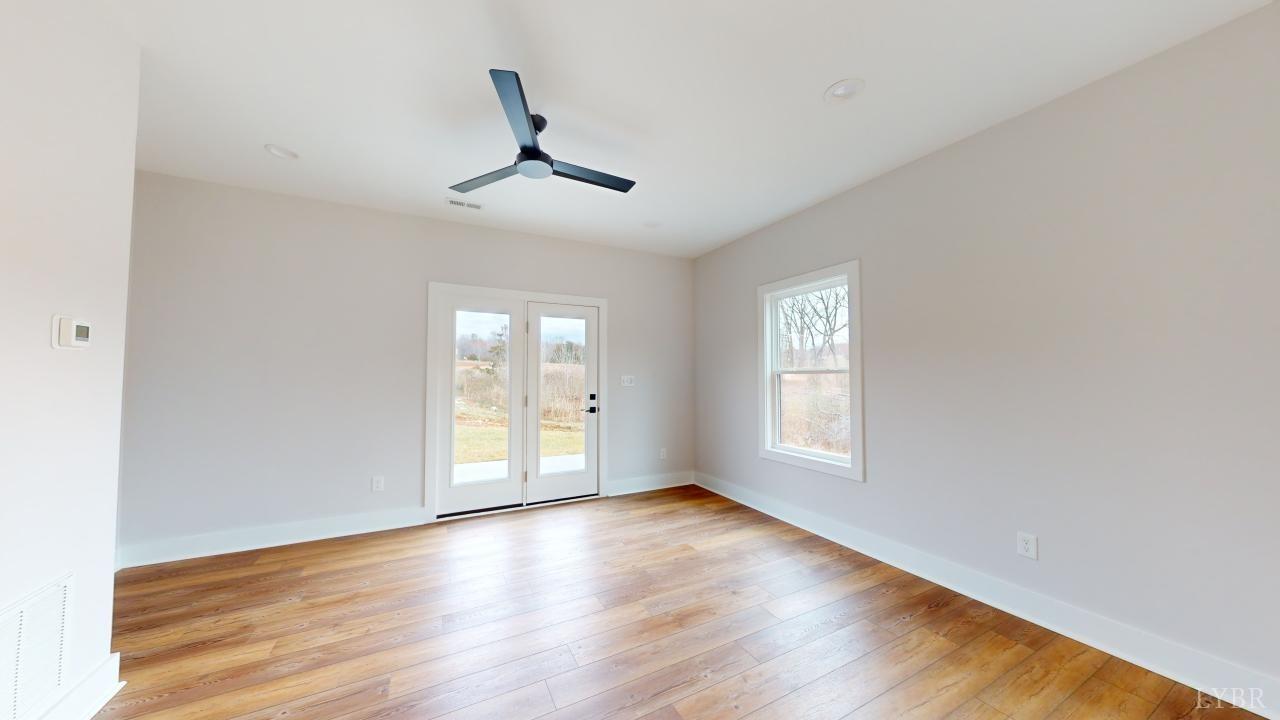 53 Shallen Road Rustburg, VA 24588 - Photo 12 of 46 a view of empty room with wooden floor and fan