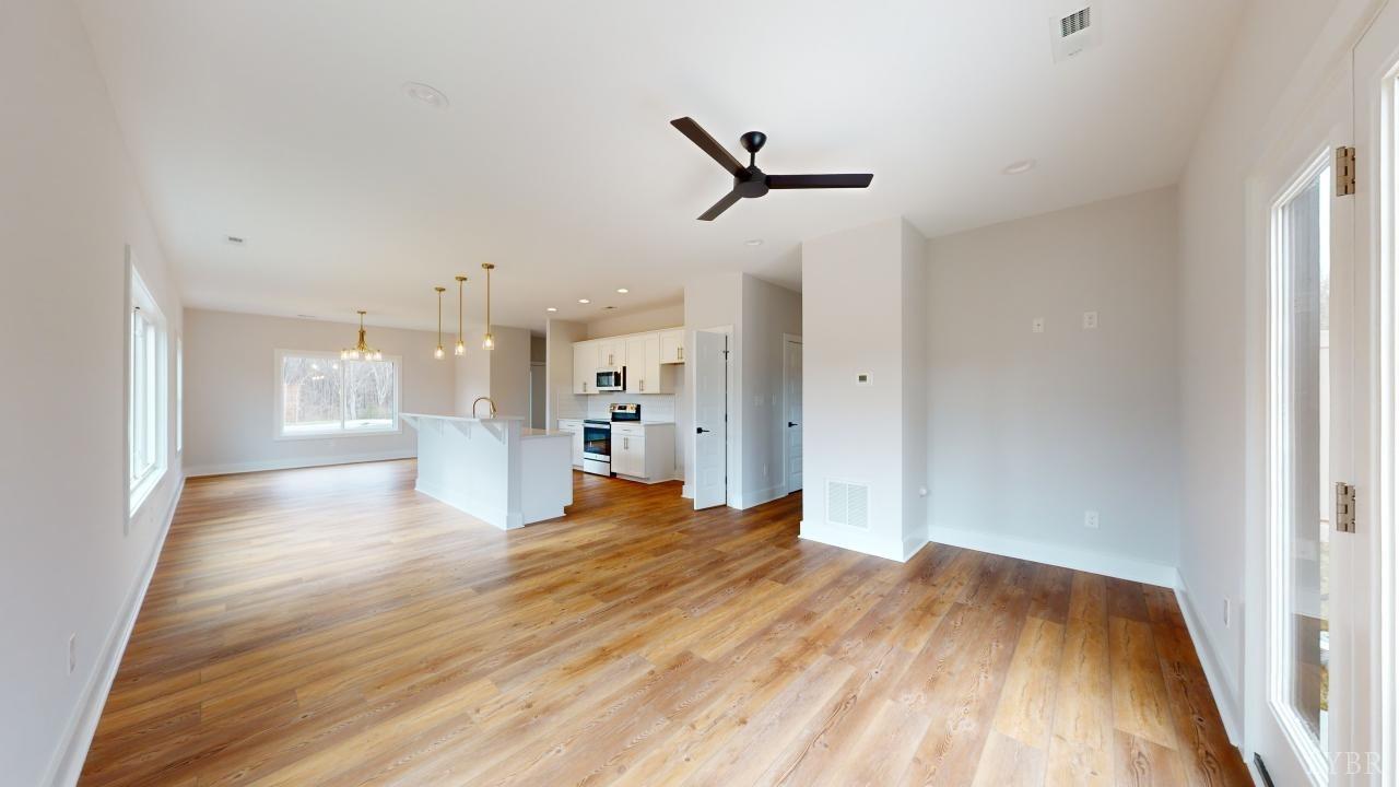 53 Shallen Road Rustburg, VA 24588 - Photo 13 of 46 a view of empty room with wooden floor and window