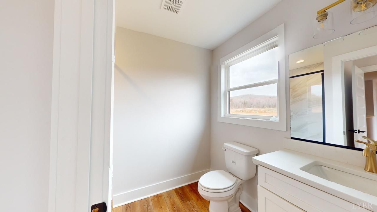53 Shallen Road Rustburg, VA 24588 - Photo 25 of 46 a white toilet sitting next to a bathroom sink