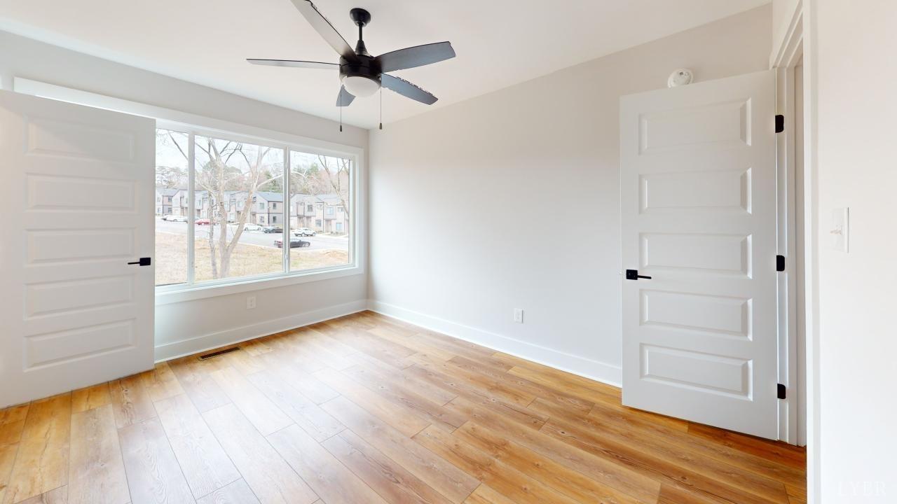 53 Shallen Road Rustburg, VA 24588 - Photo 40 of 46 wooden floor in an empty room with a window