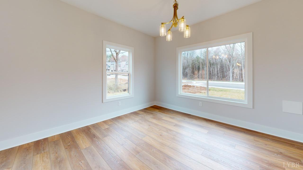 53 Shallen Road Rustburg, VA 24588 - Photo 42 of 46 a view of an empty room with wooden floor and a window
