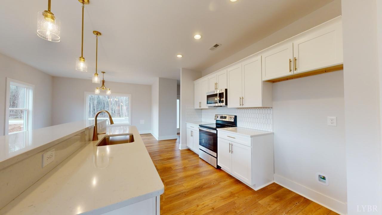53 Shallen Road Rustburg, VA 24588 - Photo 10 of 46 a kitchen with stainless steel appliances granite countertop a sink a stove and a refrigerator