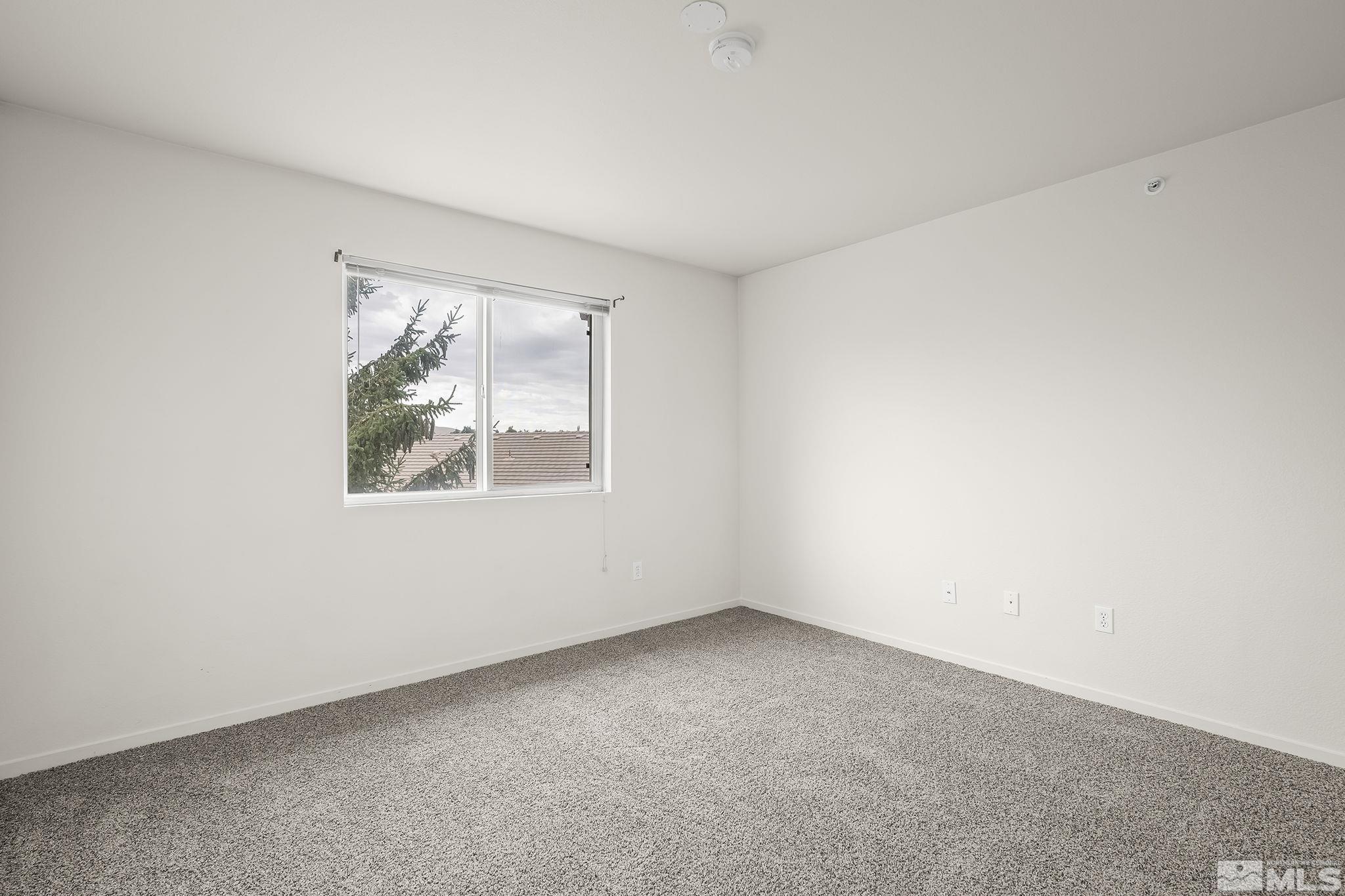 6850 Sharlands Avenue, Unit 2109 Reno, NV 89523 - Photo 13 of 16 an empty room with a window
