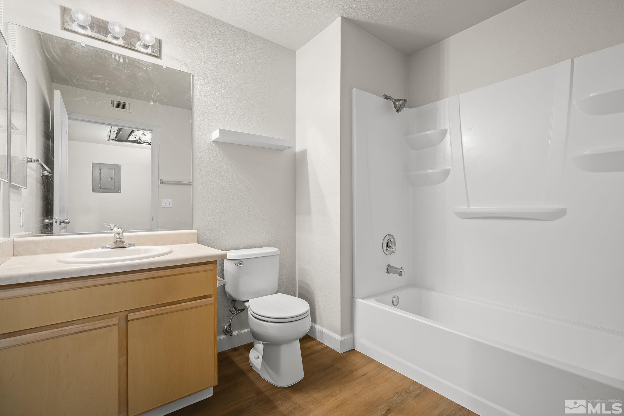 6850 Sharlands Avenue, Unit 2109 Reno, NV 89523 - Photo 14 of 16 a bathroom with a sink toilet and shower