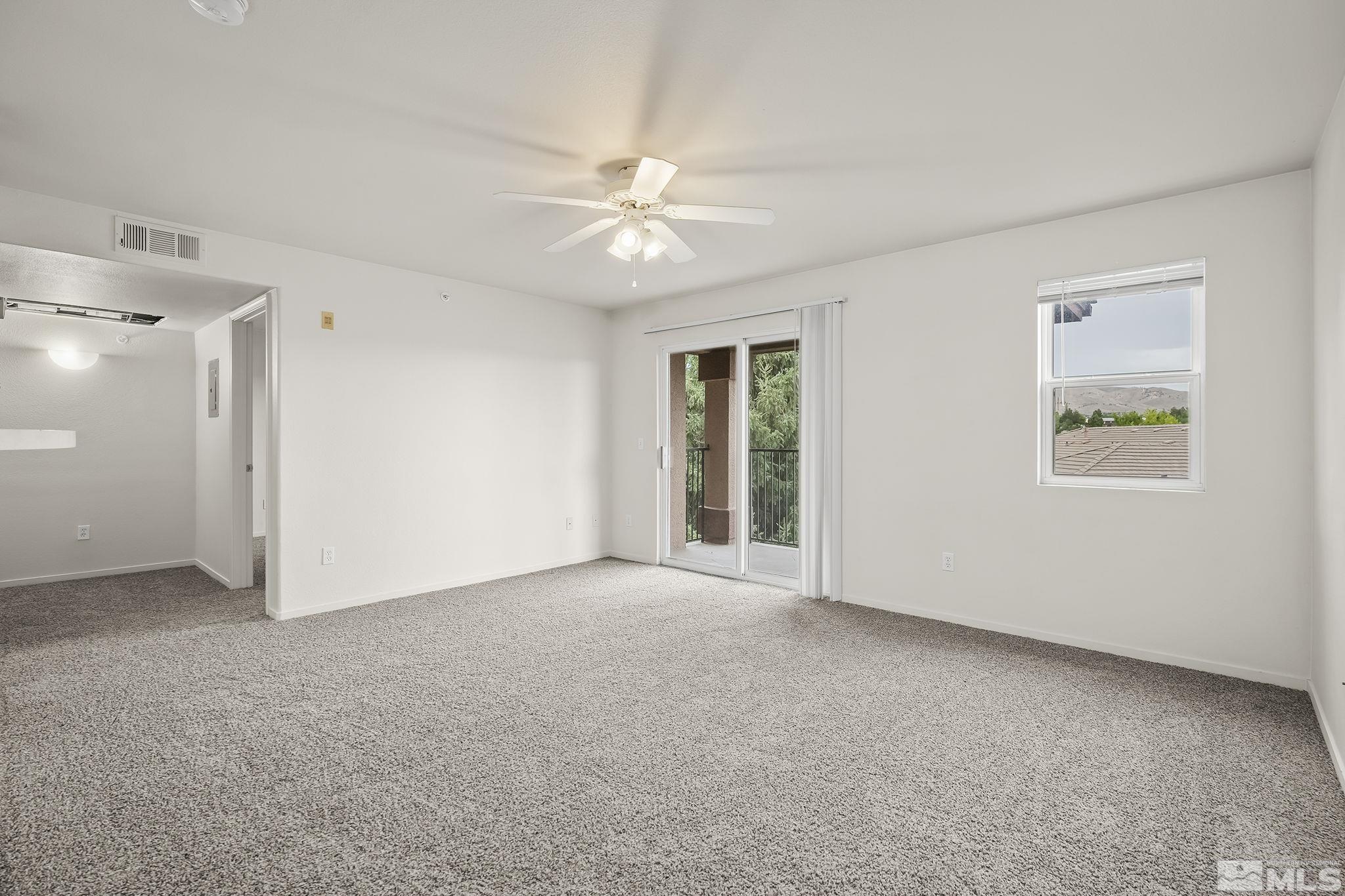 6850 Sharlands Avenue, Unit 2109 Reno, NV 89523 - Photo 3 of 16 a view of an empty room with a window