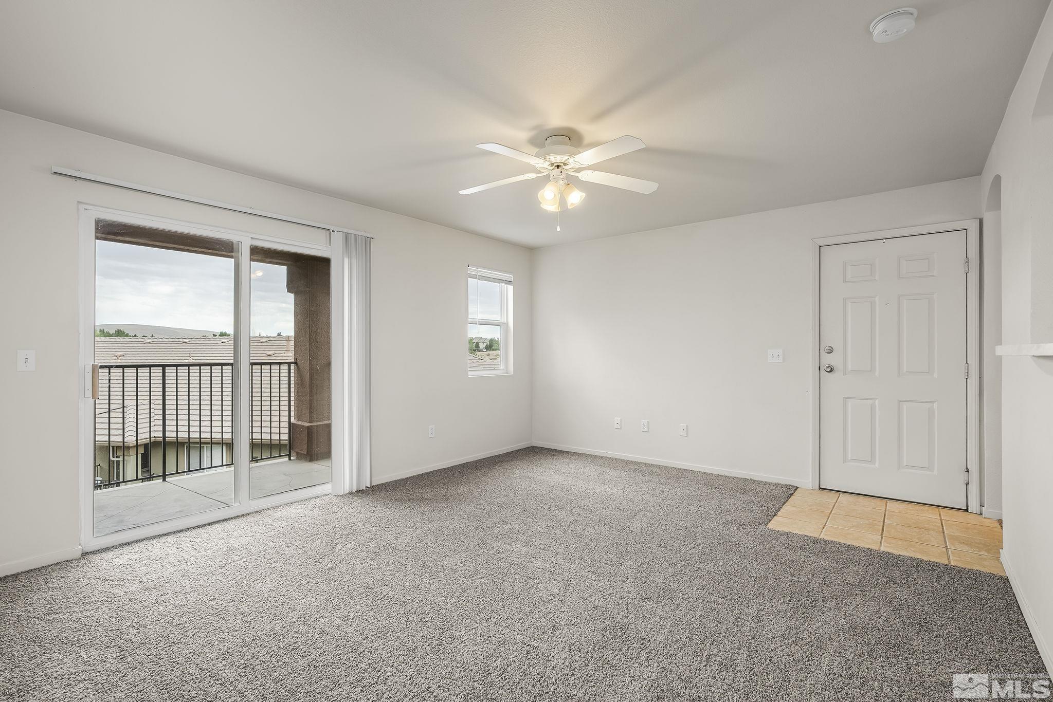 6850 Sharlands Avenue, Unit 2109 Reno, NV 89523 - Photo 6 of 16 an empty room with chandelier fan