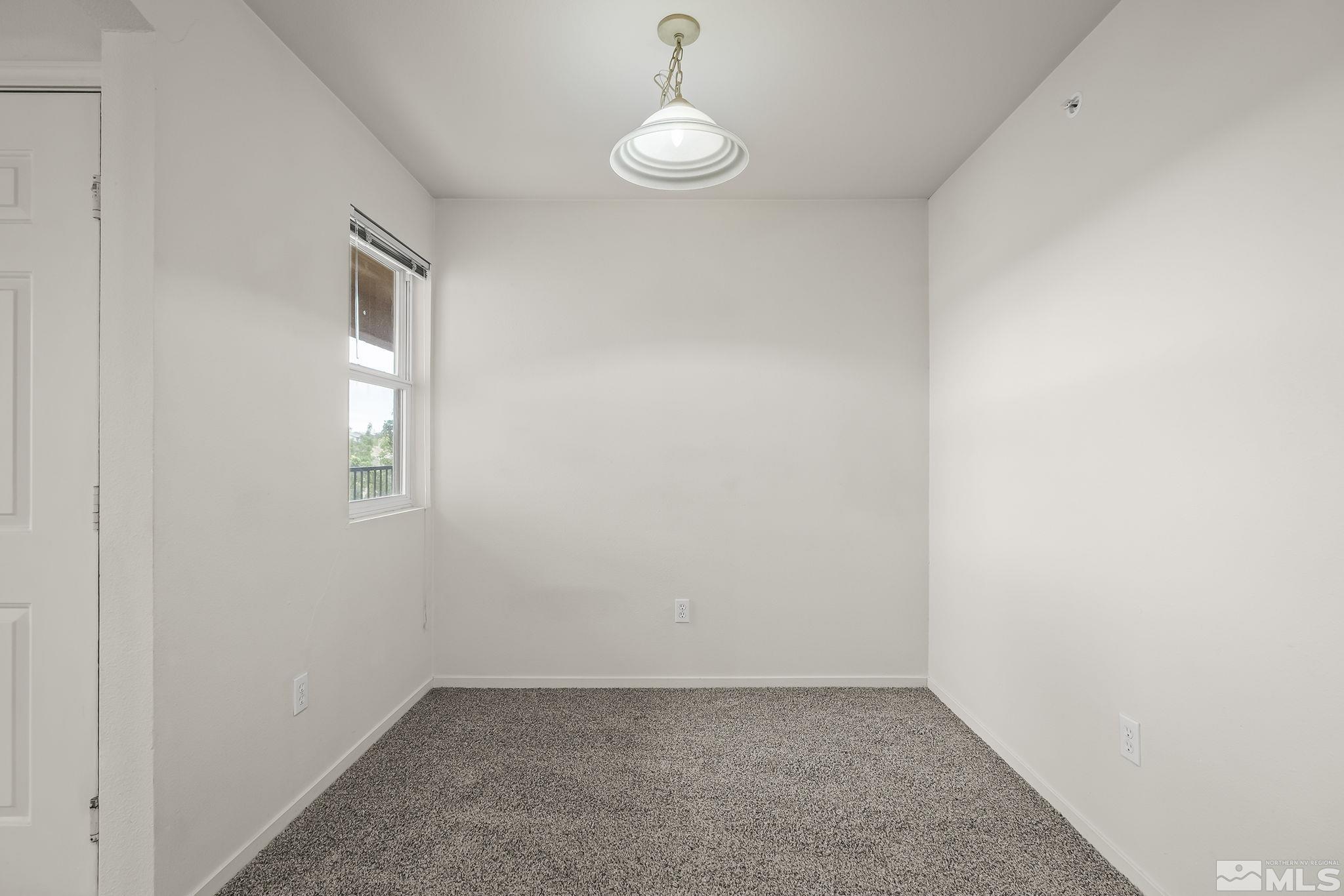 6850 Sharlands Avenue, Unit 2109 Reno, NV 89523 - Photo 8 of 16 an empty room with windows and closet