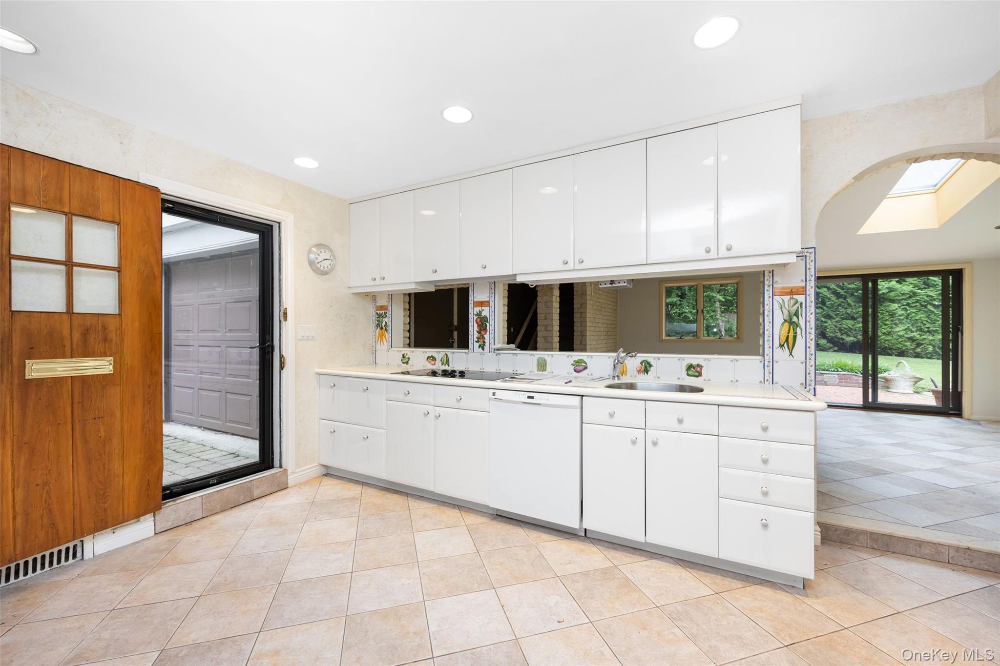 3 Buckingham Place Great Neck, NY 11021 - Photo 13 of 28 a kitchen with stainless steel appliances kitchen island granite countertop a sink and cabinets