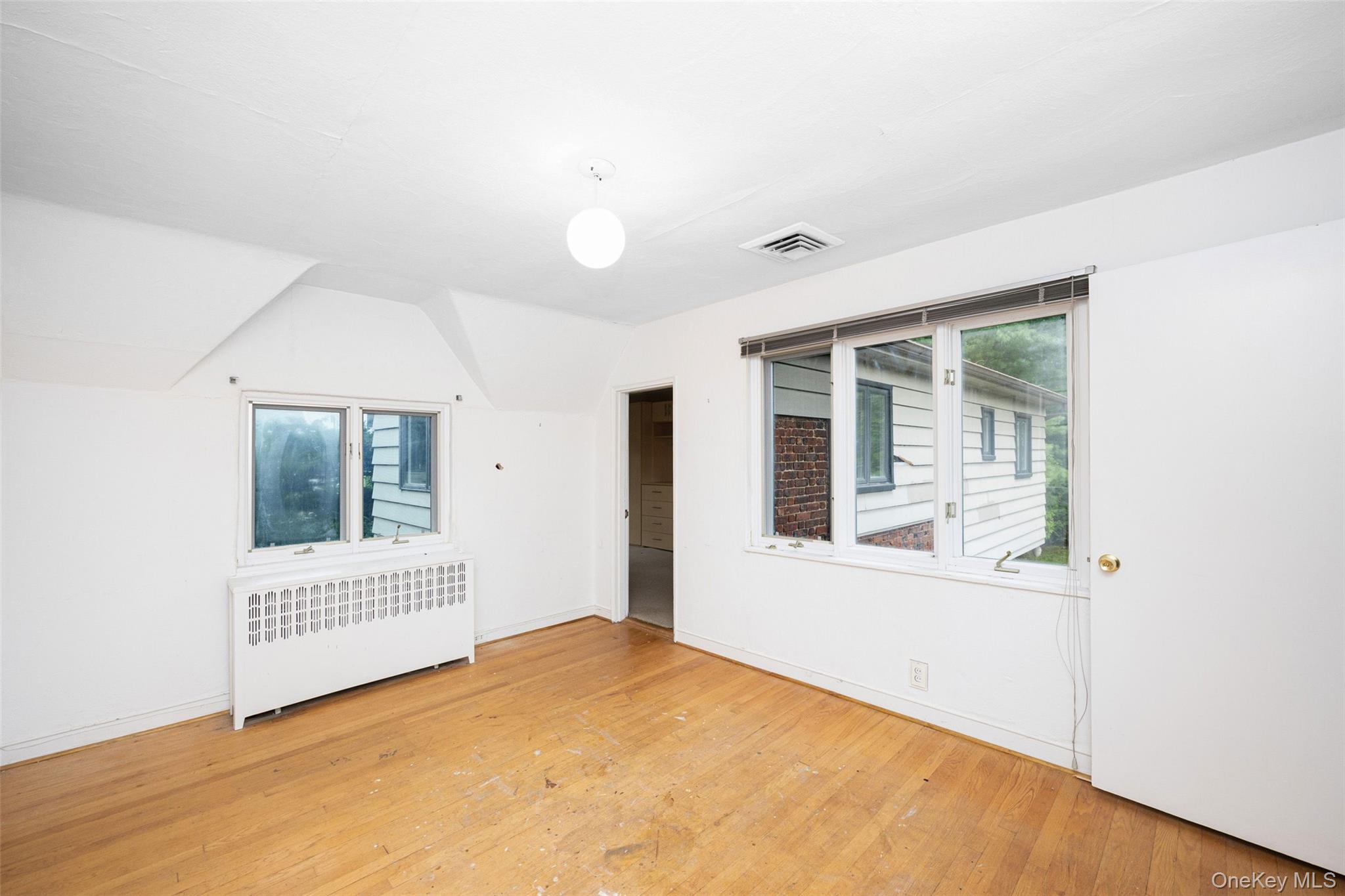 3 Buckingham Place Great Neck, NY 11021 - Photo 17 of 28 an empty room with a window