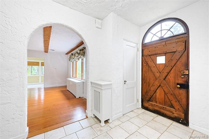 3 Buckingham Place Great Neck, NY 11021 - Photo 4 of 28 a view of entryway with wooden floor and door