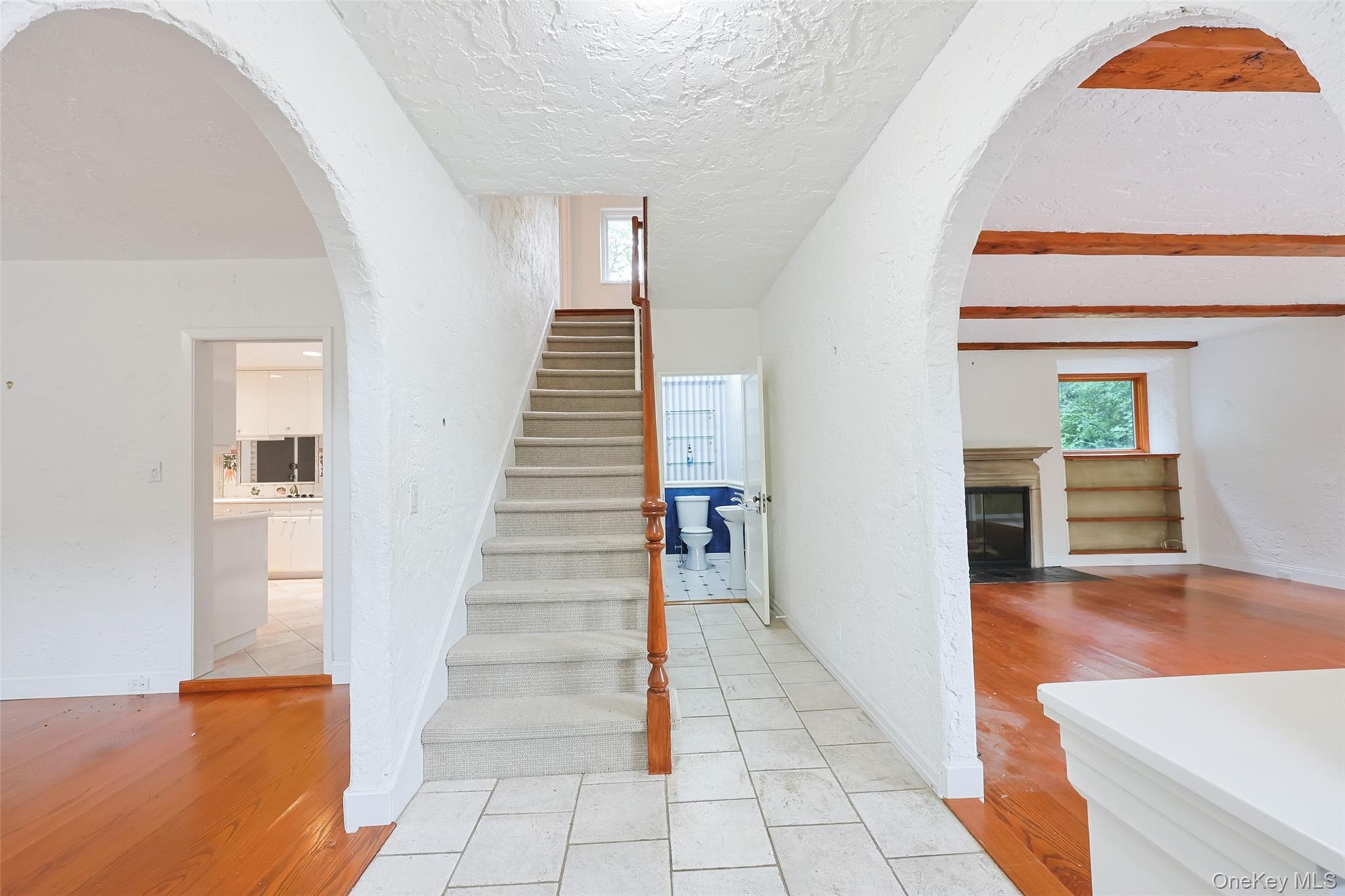 3 Buckingham Place Great Neck, NY 11021 - Photo 5 of 28 a view of a hallway view with wooden floor and staircase