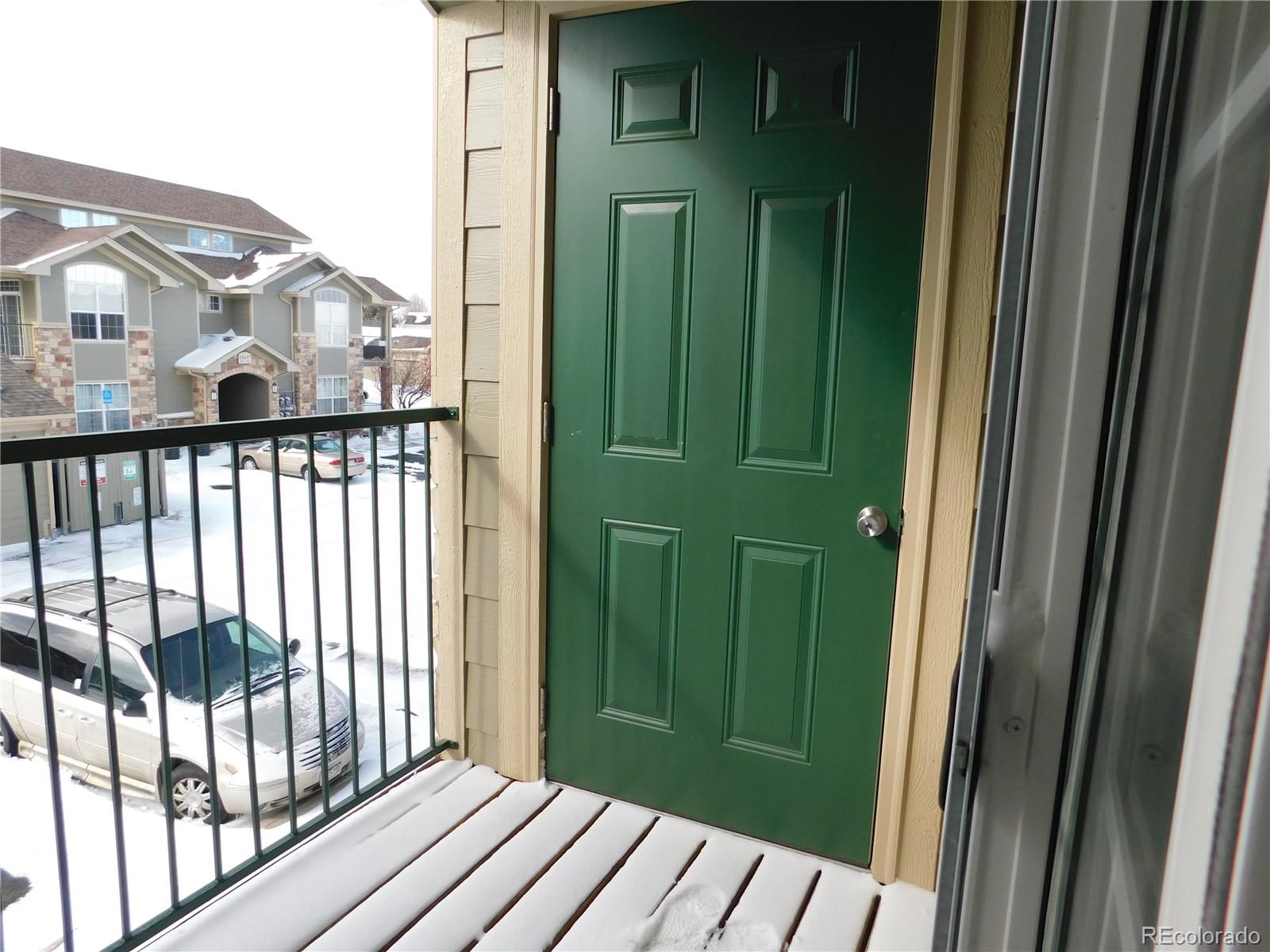 18669 Stroh Road, Unit 10204 Parker, CO 80134 - Photo 12 of 28 a view of a porch with a door
