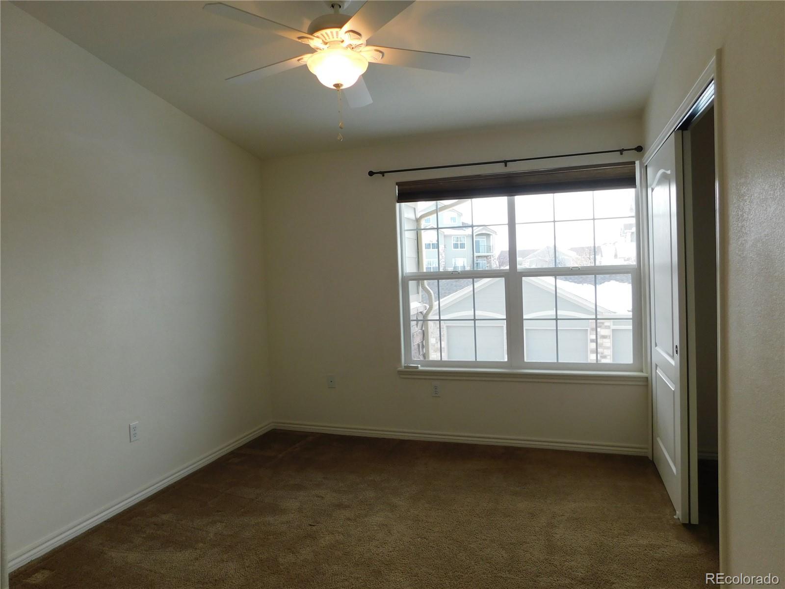 18669 Stroh Road, Unit 10204 Parker, CO 80134 - Photo 22 of 28 an empty room with a window