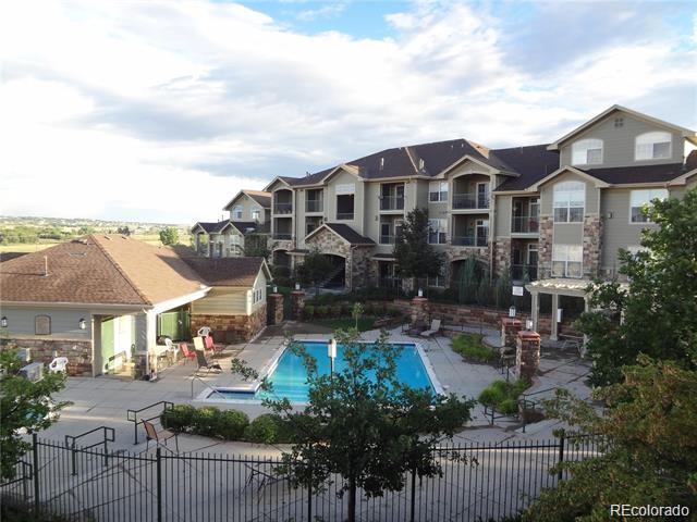 18669 Stroh Road, Unit 10204 Parker, CO 80134 - Photo 27 of 28 a front view of house with yard and outdoor seating