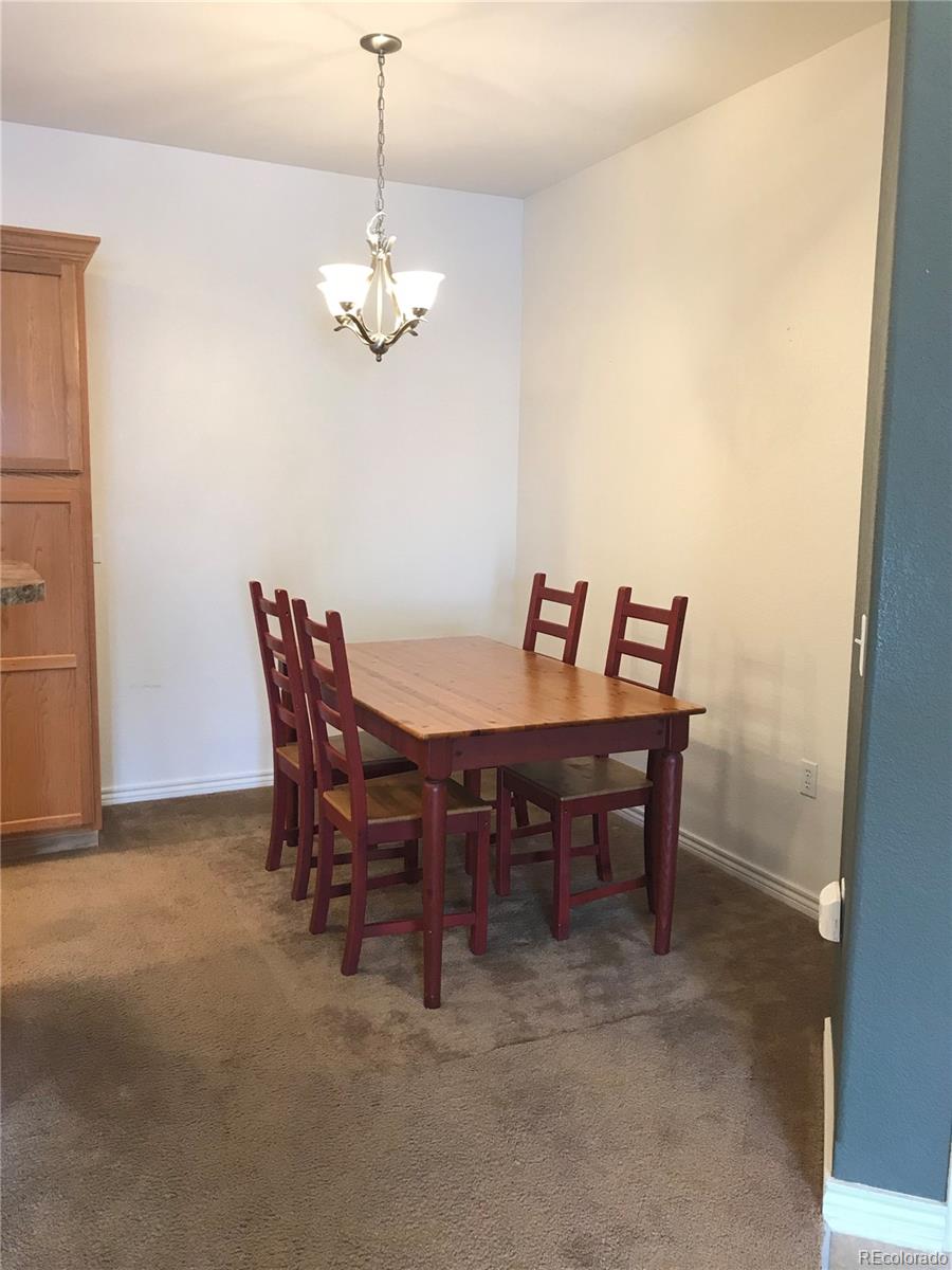 18669 Stroh Road, Unit 10204 Parker, CO 80134 - Photo 6 of 28 a view of a dining room with furniture