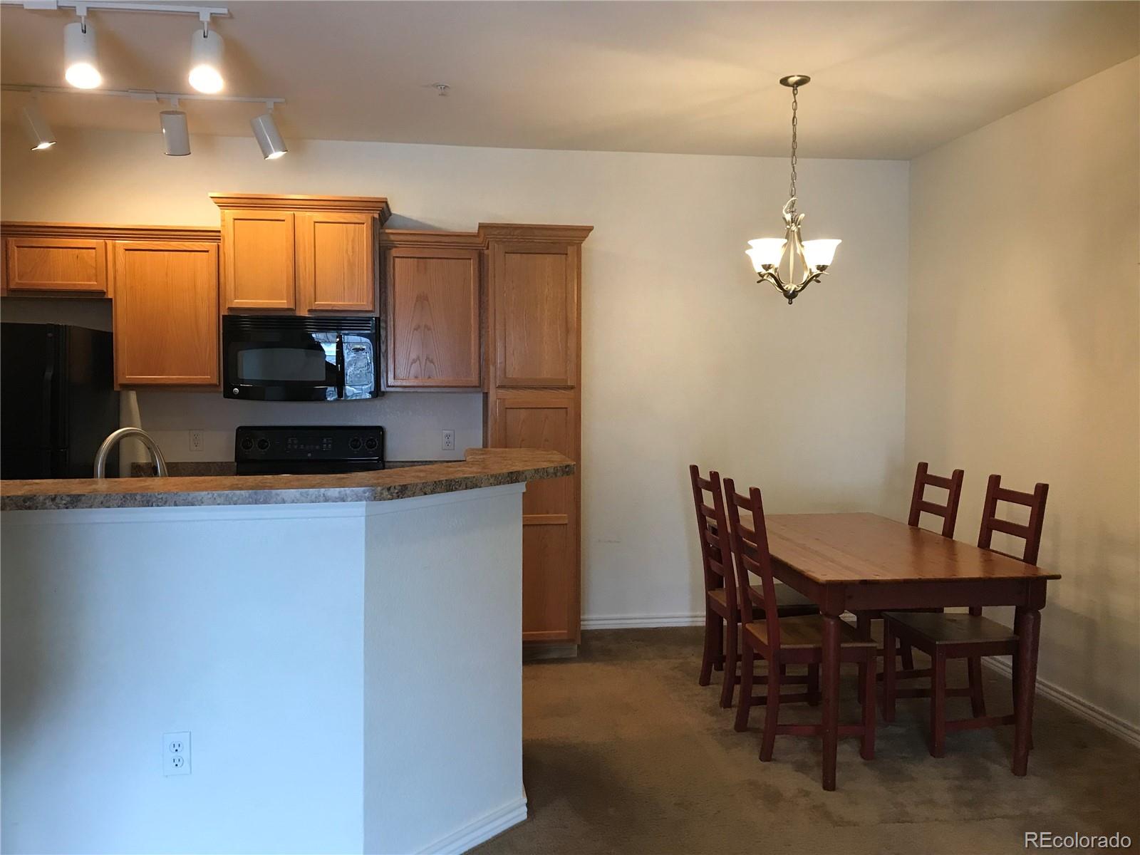 18669 Stroh Road, Unit 10204 Parker, CO 80134 - Photo 7 of 28 a view of a dining room with furniture
