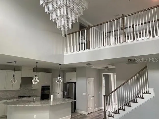 a view of a hallway with kitchen