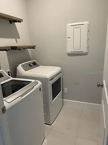 a utility room with dryer and washer