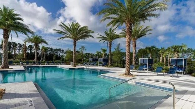 a view of a swimming pool with a table and chairs