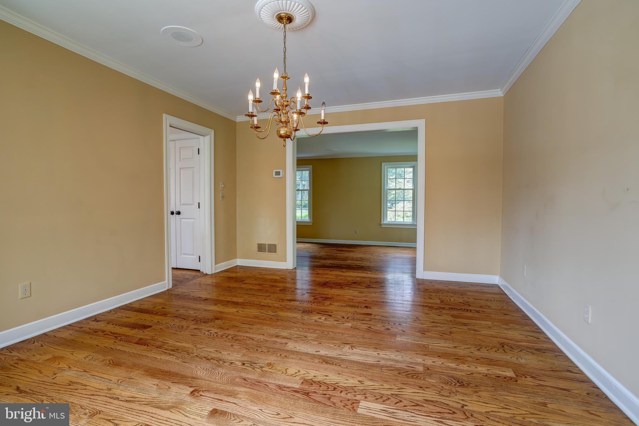 41 Old Covered Bridge Road Newtown Square, PA 19073 - Photo 13 of 58 a view of a room with wooden floor and chandelier