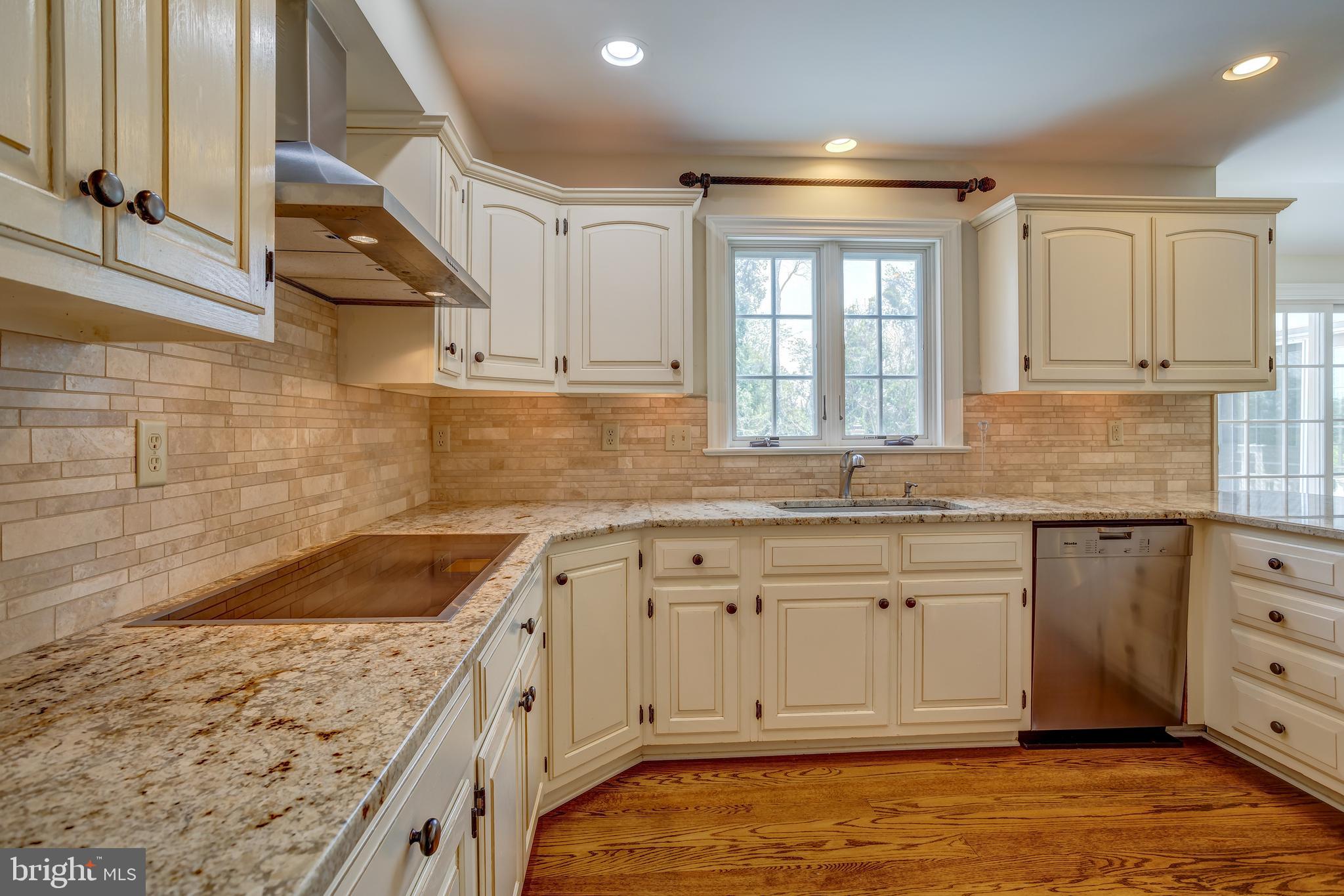 41 Old Covered Bridge Road Newtown Square, PA 19073 - Photo 14 of 58 a kitchen that has a sink and a stove