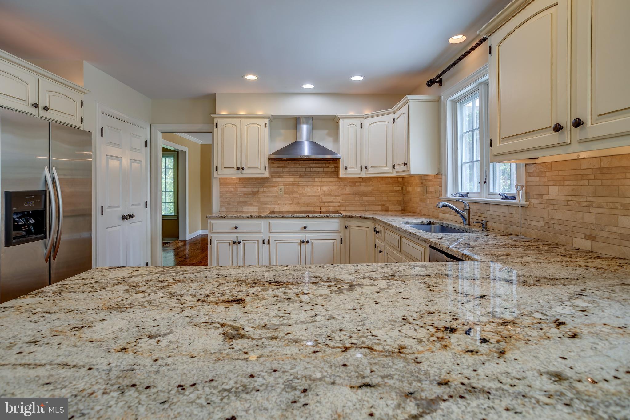 41 Old Covered Bridge Road Newtown Square, PA 19073 - Photo 16 of 58 a large kitchen with kitchen island granite countertop a sink refrigerator and cabinets