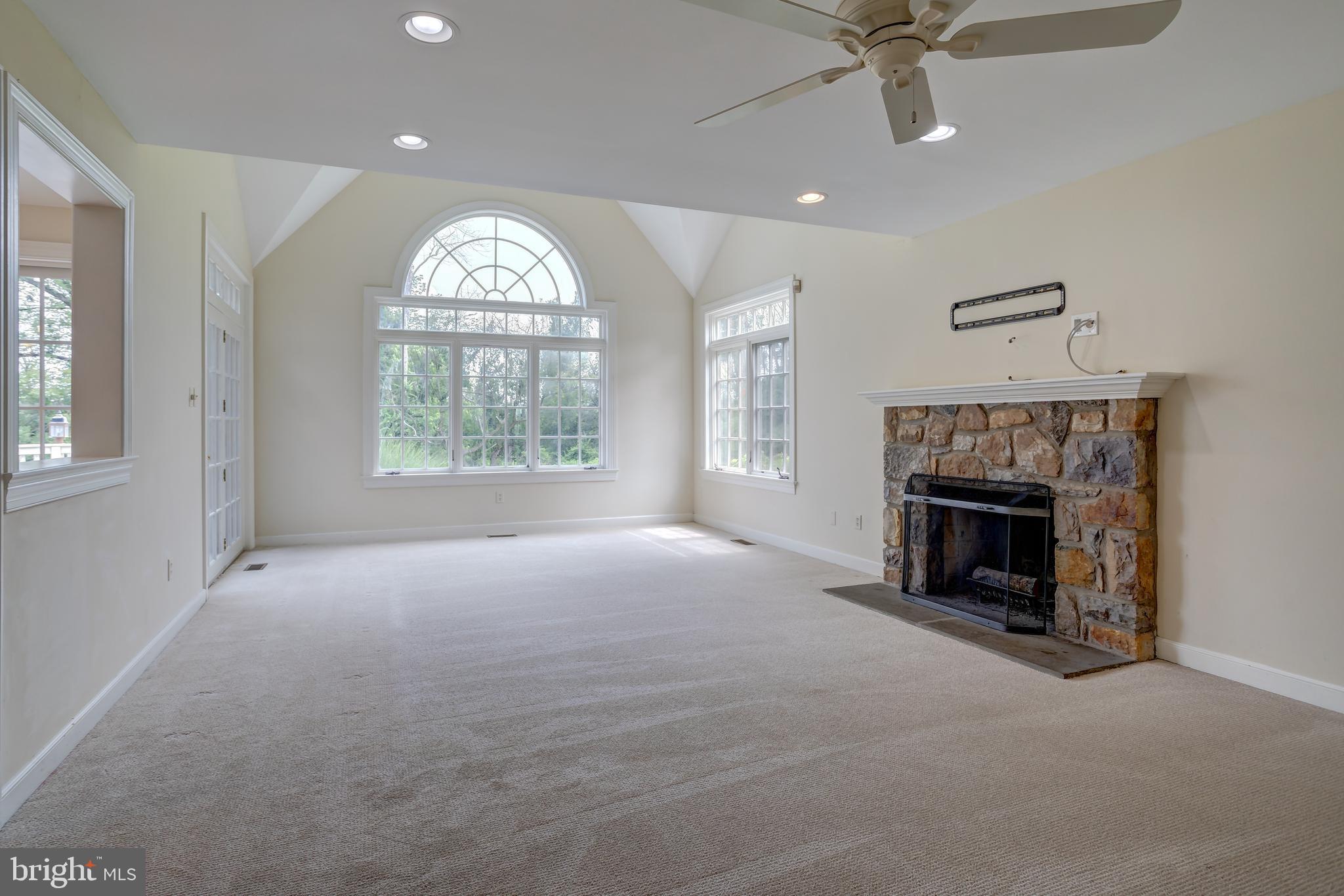 41 Old Covered Bridge Road Newtown Square, PA 19073 - Photo 20 of 58 wooden floor fireplace and windows in an empty room