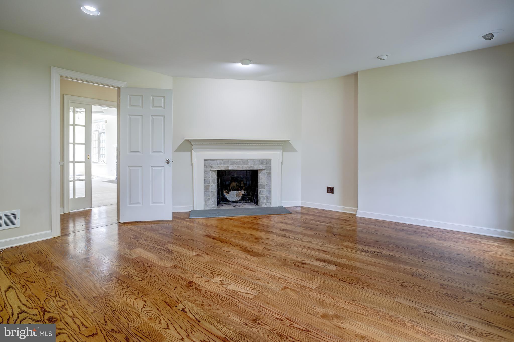 41 Old Covered Bridge Road Newtown Square, PA 19073 - Photo 26 of 58 a view of empty room with wooden floor and fireplace
