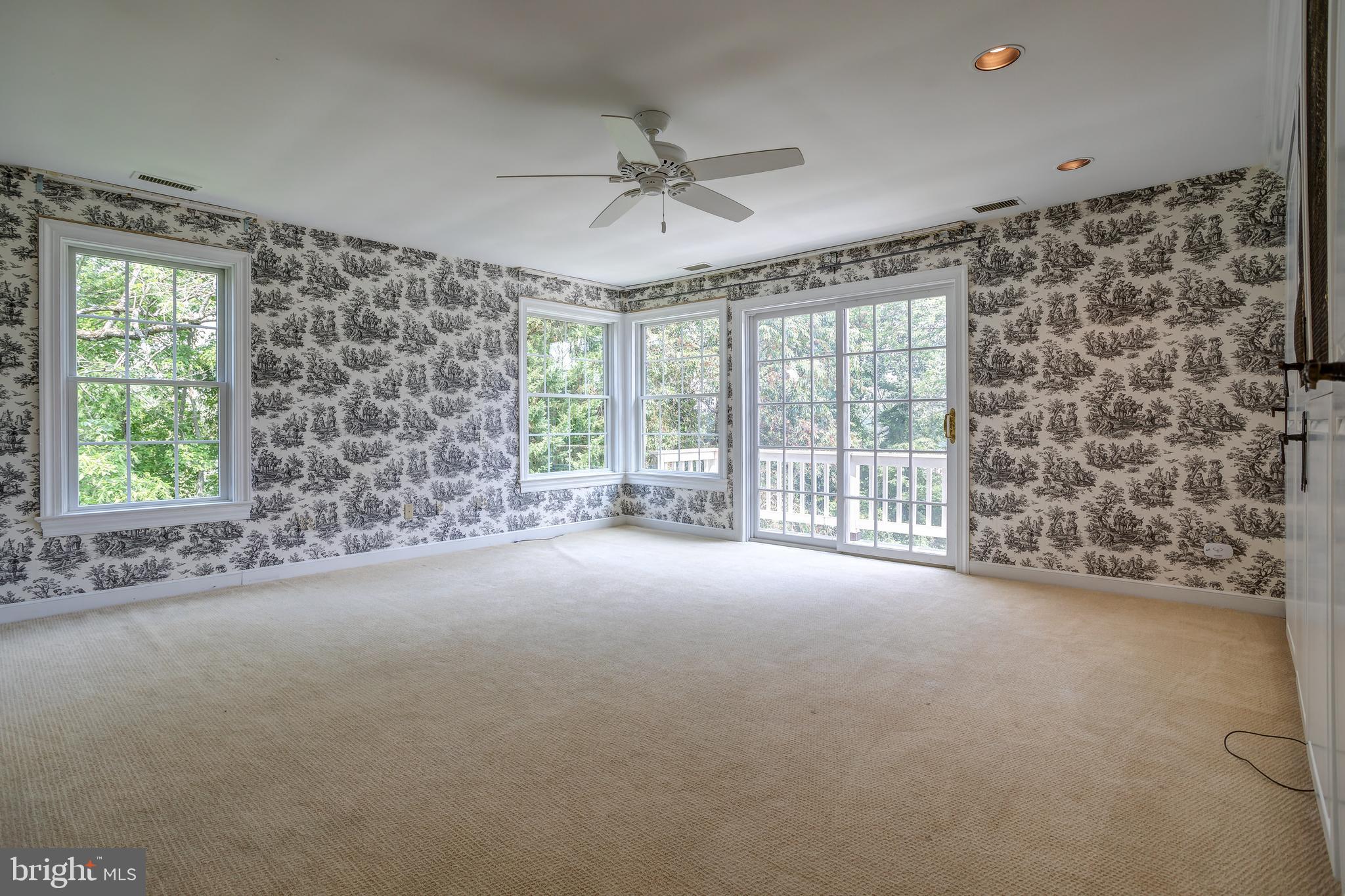41 Old Covered Bridge Road Newtown Square, PA 19073 - Photo 31 of 58 a view of a livingroom with a ceiling fan and window
