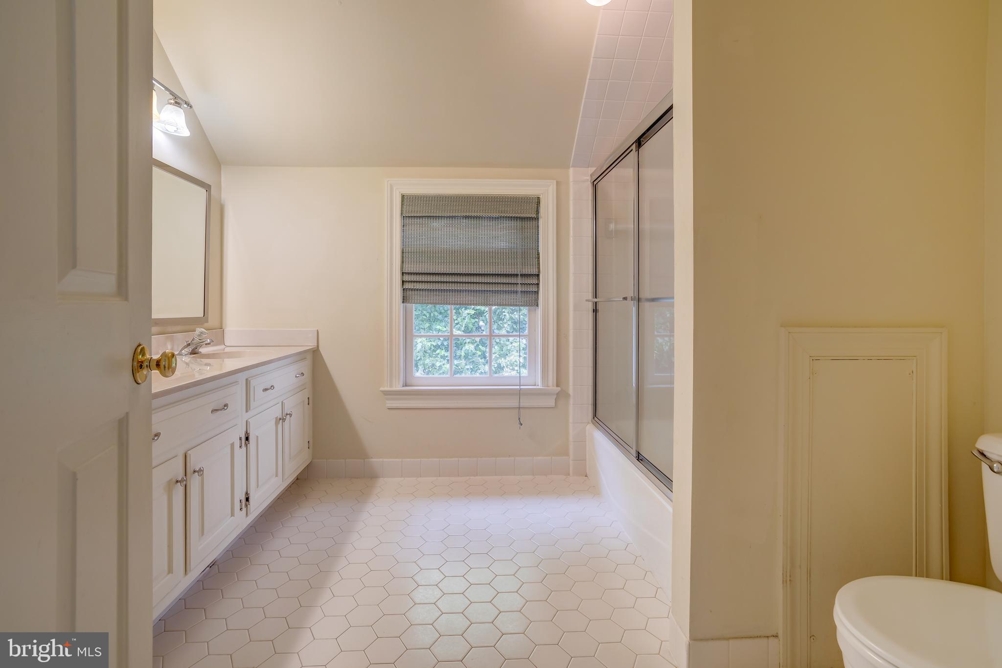 41 Old Covered Bridge Road Newtown Square, PA 19073 - Photo 43 of 58 a bathroom with a double vanity sink toilet and shower